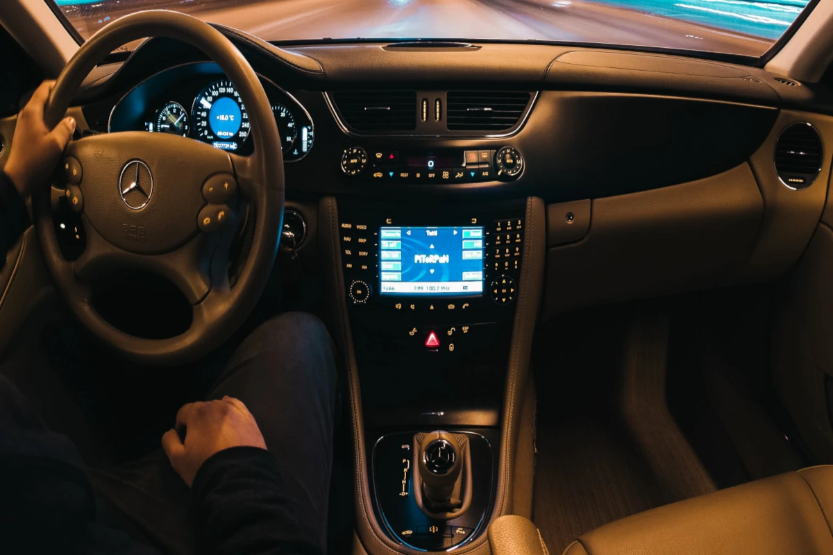 The car stereo system plays while a person driving