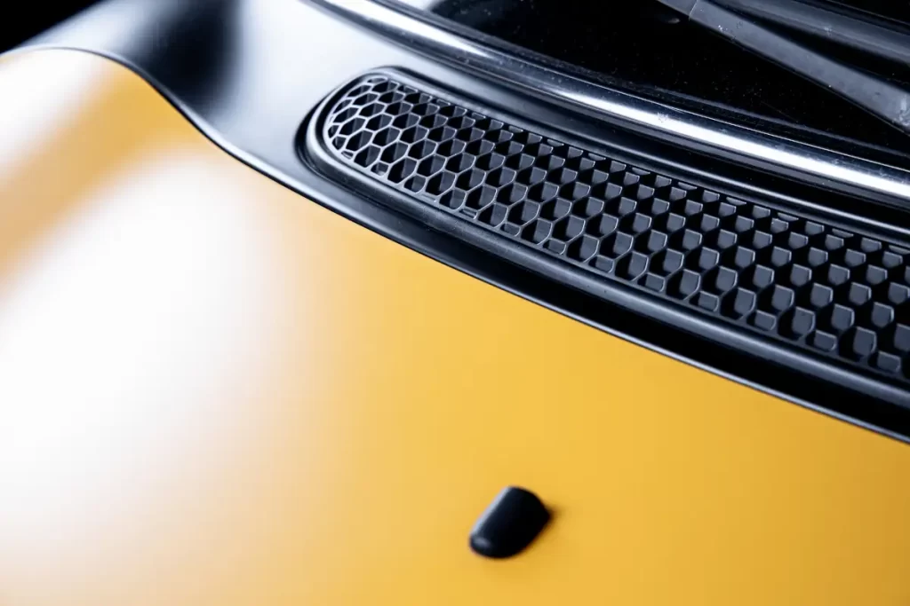 Yellow car cowl induction hood vents