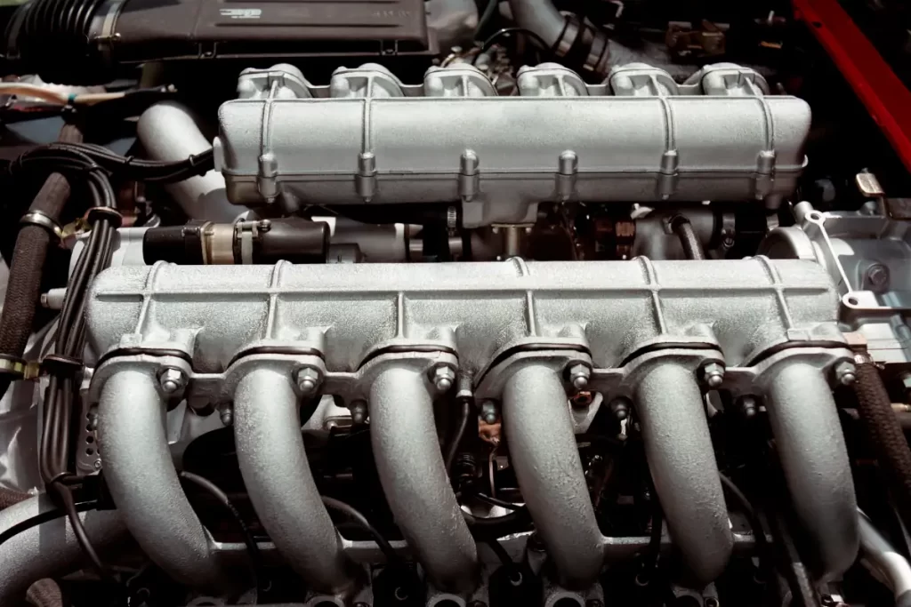 car twelve cylinder engine connected with manifold