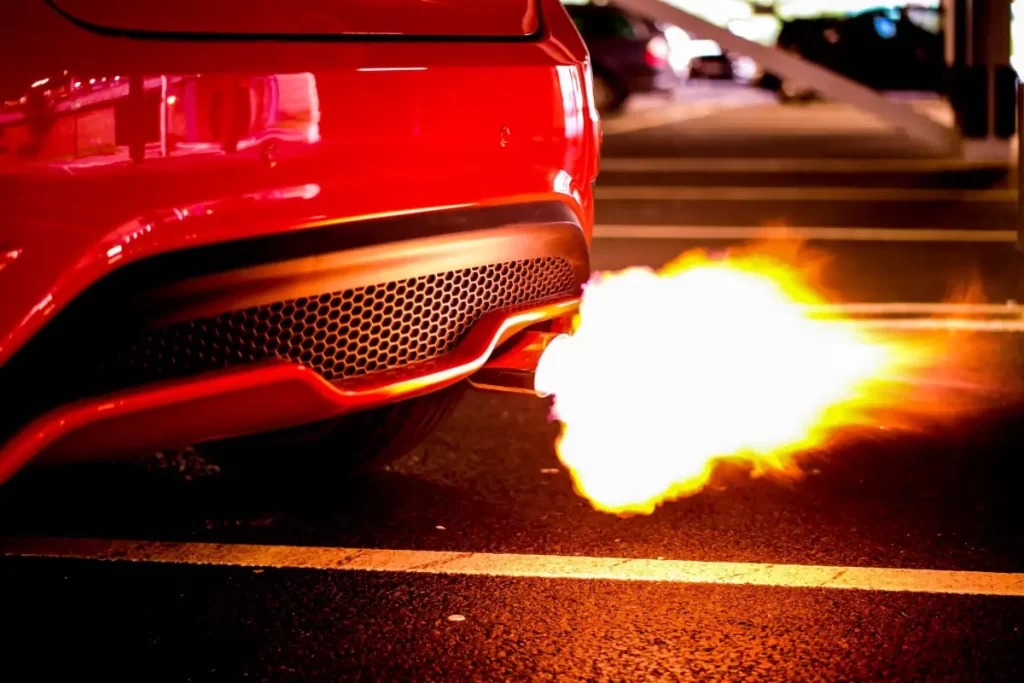 Red car exhaust burble crackle pop tunes with flames