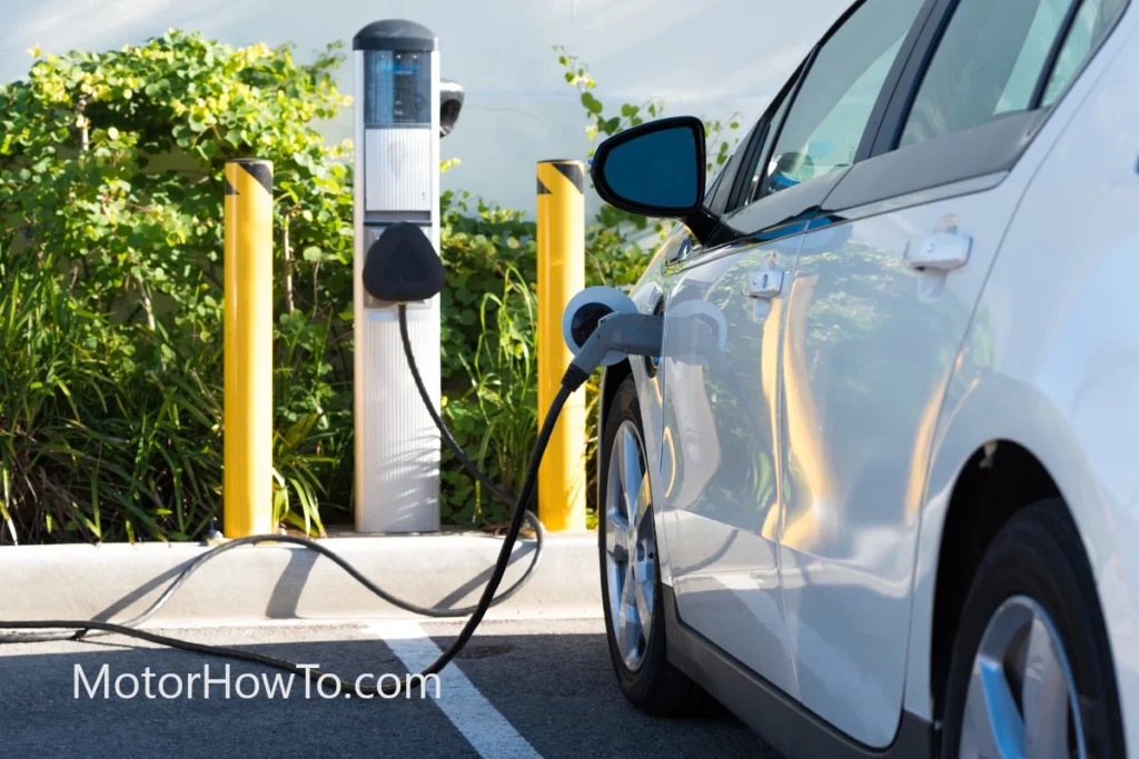 White electric car (EV) charging as an alternative to gas.