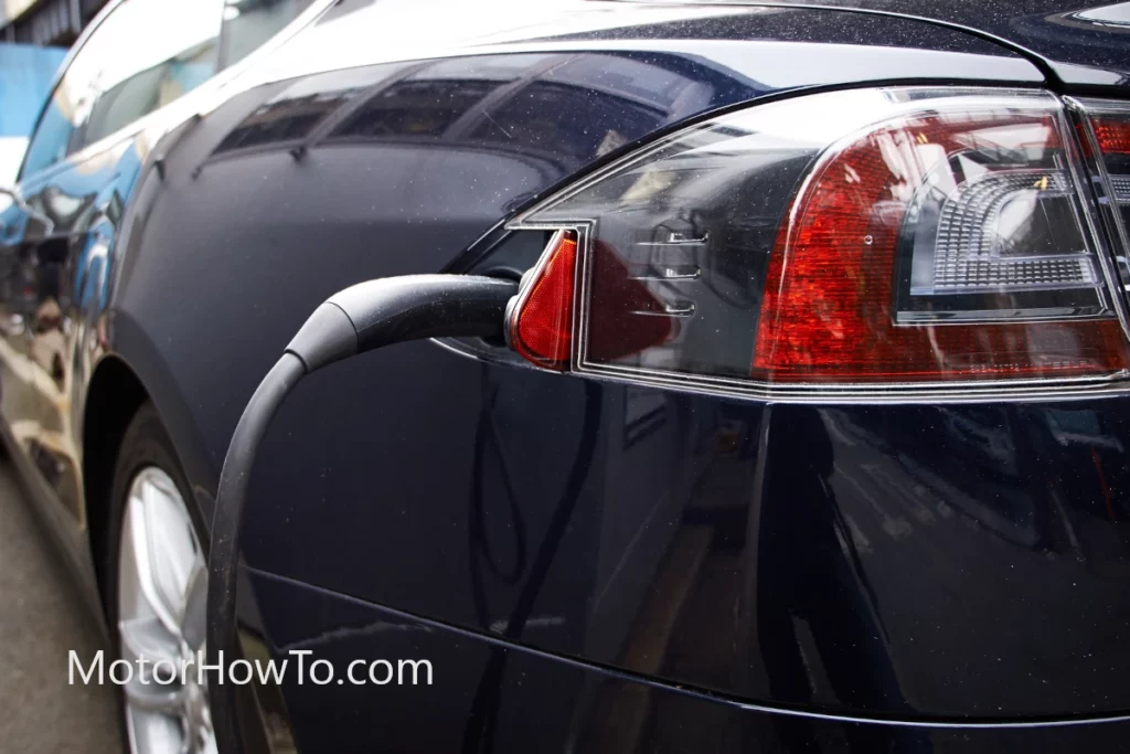 Blue Tesla Model S with Dual Motor (AWD) charging