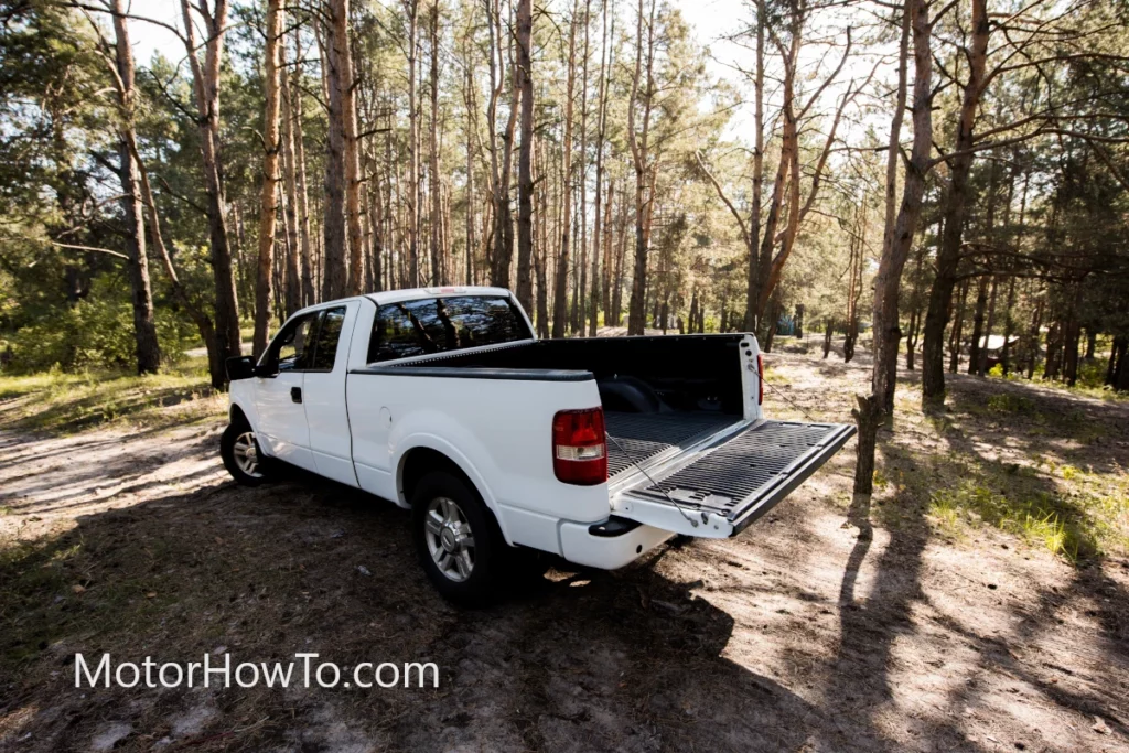 White pickup truck ready to load in woods